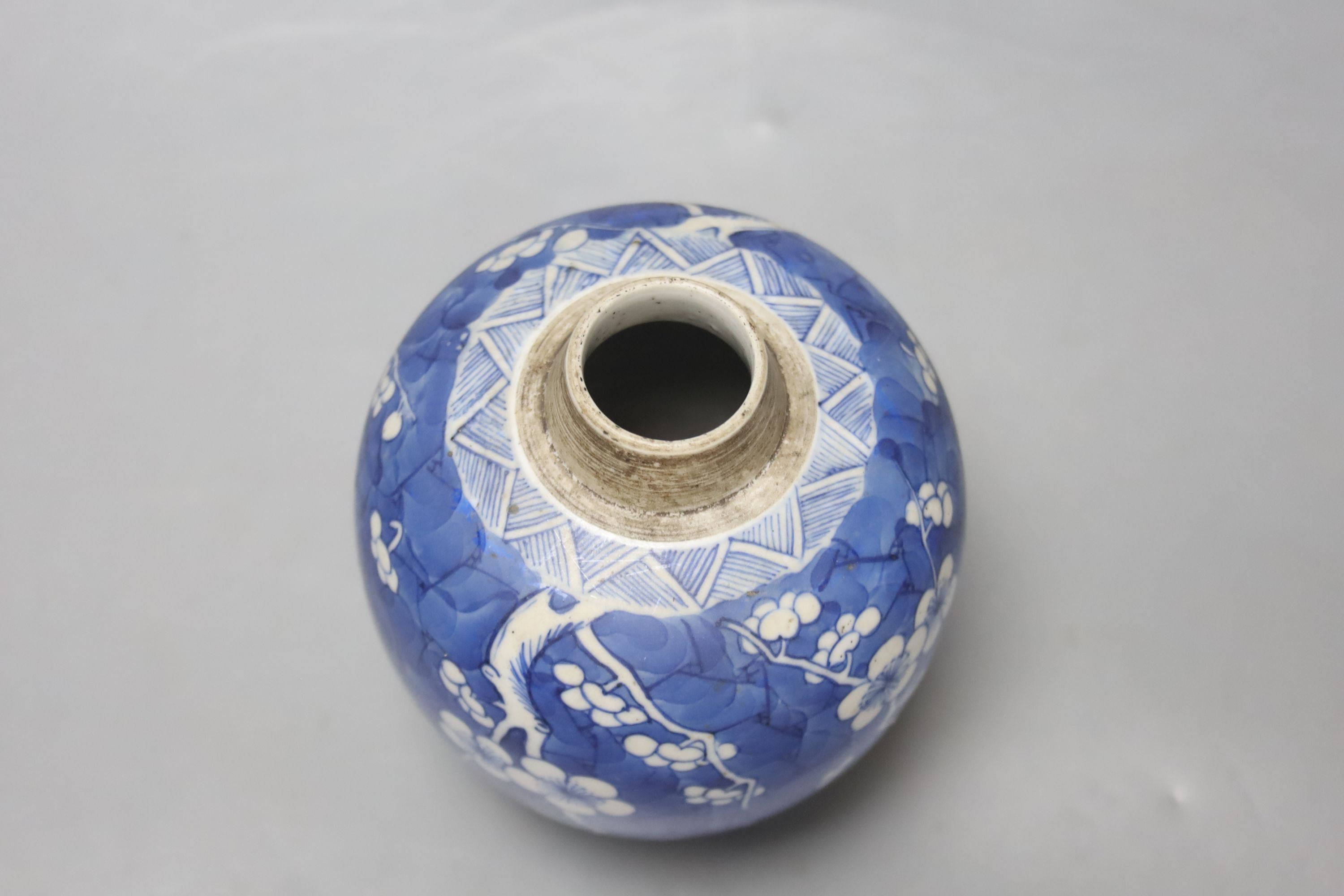 A Chinese Kangxi blue and white prunus jar, lacking cover, height 12cm